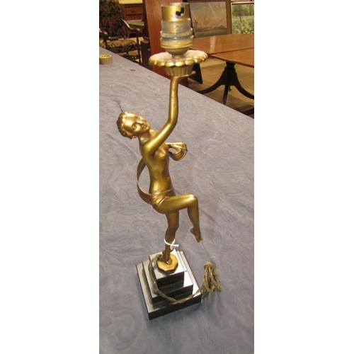 64 - An art deco gilt metal dancing figure table lamp supported on stepped marble base, electrolier.  The... 