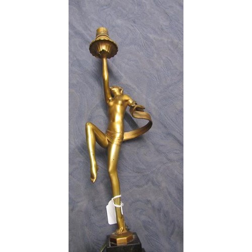 64 - An art deco gilt metal dancing figure table lamp supported on stepped marble base, electrolier.  The... 