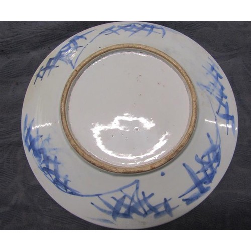 354 - A 19c Chinese blue and white circular dish decorated with Prunus blossom, 29cms dia.