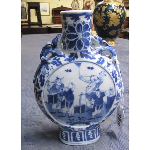 358 - A 19c Chinese moon flask, blue on white decorated with panels of entertainers and moulded serpents t... 