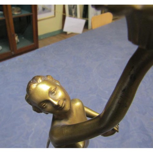 64 - An art deco gilt metal dancing figure table lamp supported on stepped marble base, electrolier.  The... 