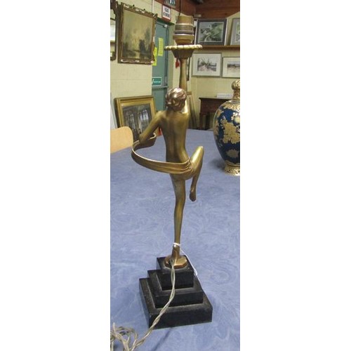 64 - An art deco gilt metal dancing figure table lamp supported on stepped marble base, electrolier.  The... 