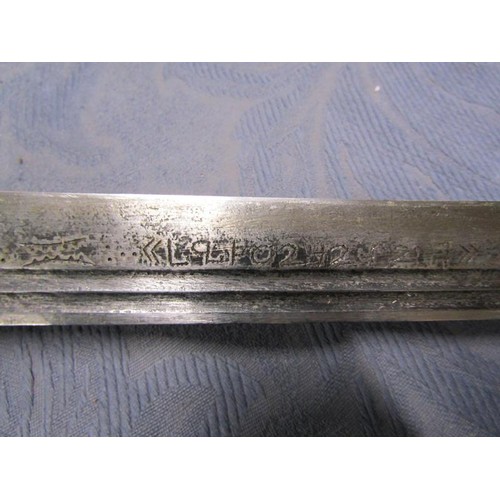 3 - An Arabic Khevsors sword and sheath with a 70cm blade.  81cms l overall.