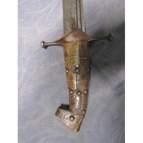 3 - An Arabic Khevsors sword and sheath with a 70cm blade.  81cms l overall.