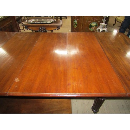 587 - A Victorian mahogany extending dining table, the table top with moulded edge having deep frieze and ... 