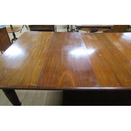 587 - A Victorian mahogany extending dining table, the table top with moulded edge having deep frieze and ... 