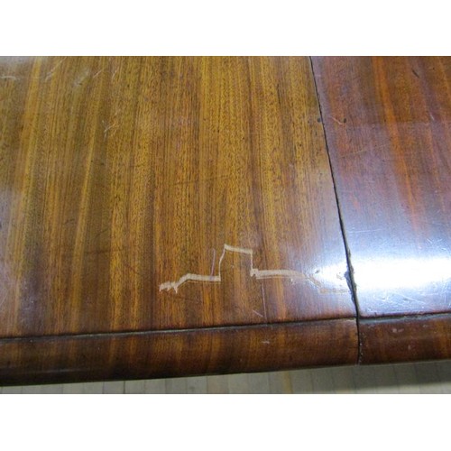 587 - A Victorian mahogany extending dining table, the table top with moulded edge having deep frieze and ... 