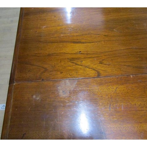 587 - A Victorian mahogany extending dining table, the table top with moulded edge having deep frieze and ... 