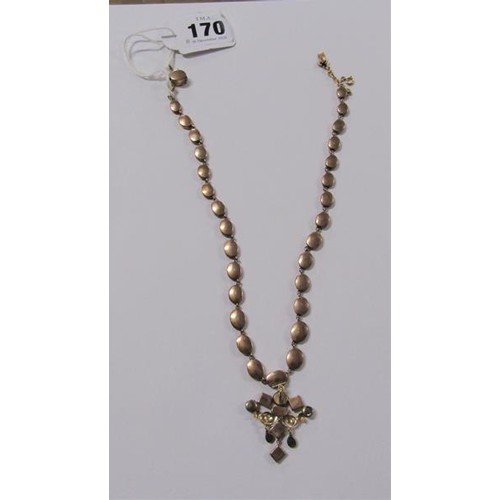 170 - A gold and Spinel set necklet with pendant, 40cms l. weight 26.2g.