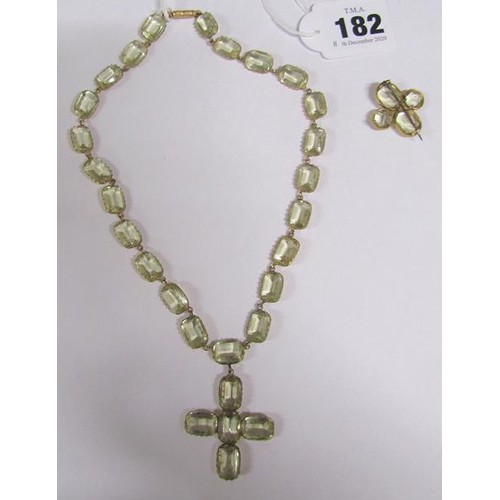 182 - A gilt metal yellow Beryl set necklace with pendant cross, together with a brooch.  Necklace 36cms l... 