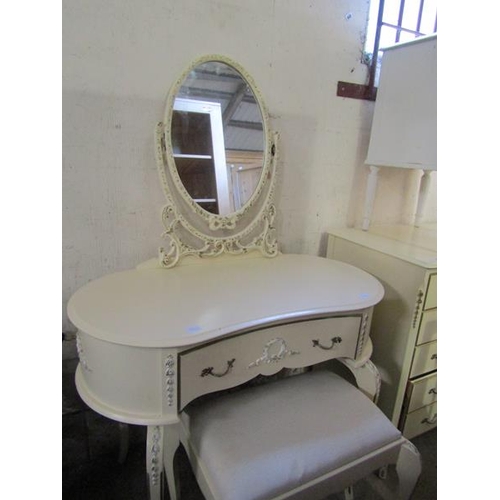 1203 - CREAM FIVE DRAWER CHEST; THREE DRAWER BEDSIDE CHEST; KIDNEY SHAPED DRESSING TABLE; STOOL