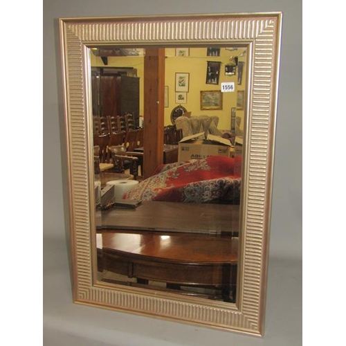 1556 - GILDED AND MOULDED FRAMED WALL MIRROR 83 x 58 cms