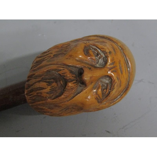 1679 - LATE 19/EARLY 20c WALKING CANE, THE HANDLED CARVED AS A BEARDED GENTLEMAN - 90cms L