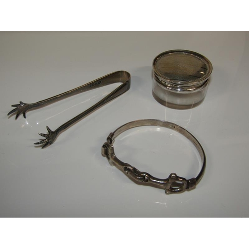 1766 - SILVER TOPPED CLEAR GLASS COSMETIC BOTTLE, SILVER BRACELET AND A PAIR OF SILVER CLAW TONGS