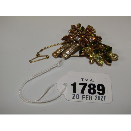 1789 - GILT METAL MULTI STONE SET FLORAL BROOCH WITH UNIDENTIFIED STAMP TO REAR