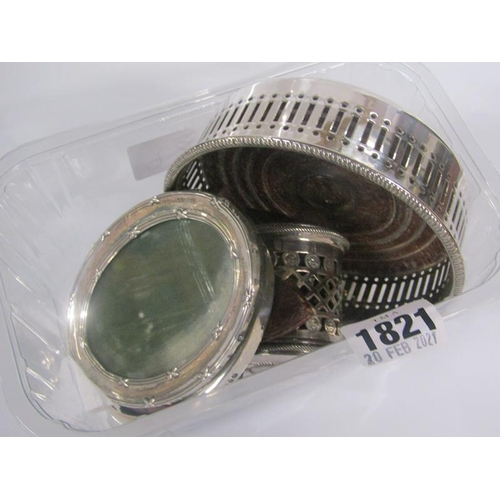 1821 - SILVER PLATED PIERCED BOTTLE COASTER, ONE PLATED MUSTARD AND TWO SMALL SILVER OVAL PHOTO FRAMES