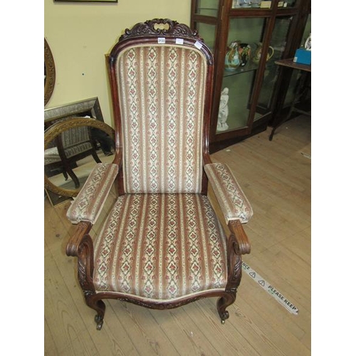 2133 - 19c MAHOGANY CARVED SHOW FRAMED AND UPHOLSTERED OPEN ARMCHAIR WITH SCROLLING ARMS ON CASTORS 116cms ... 