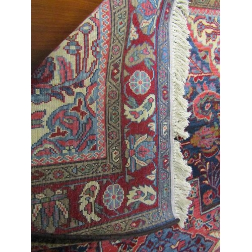 2136 - PERSIAN WOOL AND RED GROUND RUG - 140cms W