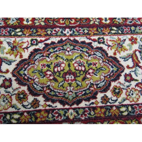 2137 - PERSIAN WOOLLEN RED AND FAWN GROUND CARPET OF FLORAL PATTERN - 289cms W