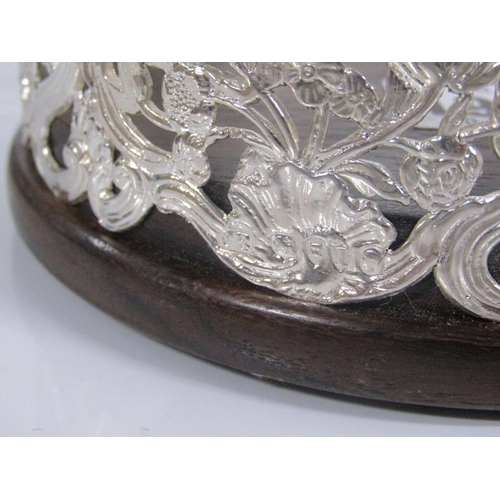 1904 - VICTORIAN SILVER BOTTLE COASTER OF ROCOCO FORM, PIERCED WITH FLOWERS AND FOLIAGE WITH WOODEN BASE, 1... 