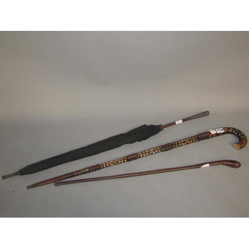 1729 - CANOE PADDLE (133cms L), LEATHER BOUND STICK, MOTHER OF PEARL WALKING STICK AND AN UMBRELLA WITH SIL... 