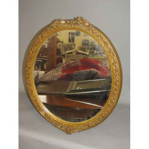 1548 - PAIR OF GILT WOODEN STUCCO OVAL WALL MIRRORS EACH APPROX 65 x 55cms (A/F)