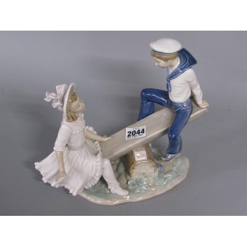 2044 - LLADRO PORCELAIN FIGURE GROUP - GIRL AND BOY ON SEASAW, 26CM W