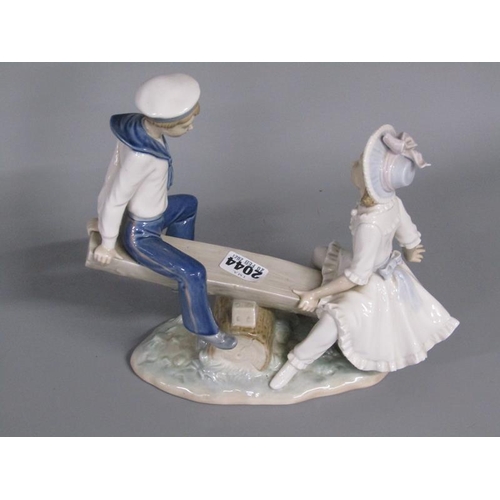 2044 - LLADRO PORCELAIN FIGURE GROUP - GIRL AND BOY ON SEASAW, 26CM W