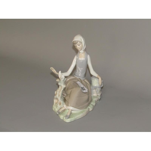 2052 - LLADRO PORCELAIN FIGURE GROUP - GRIL SEATED WITH DOVE, 18CM H