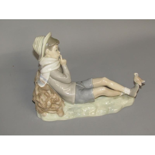 2054 - LLADRO PORCELAIN FIGURE - BOY RESTING WITH BIRD, 15CM H