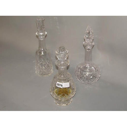 2076 - THREE WATERFORD CRYSTAL DECANTERS AND STOPPERS TO INCL LISMORE, LARGEST 34C H