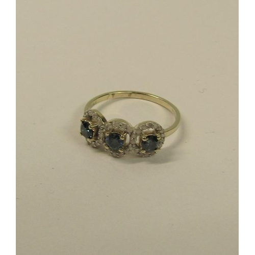 104 - Gold three stone ring set with blue and white diamonds - ring size appx S