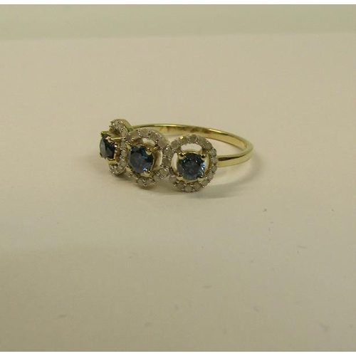 104 - Gold three stone ring set with blue and white diamonds - ring size appx S