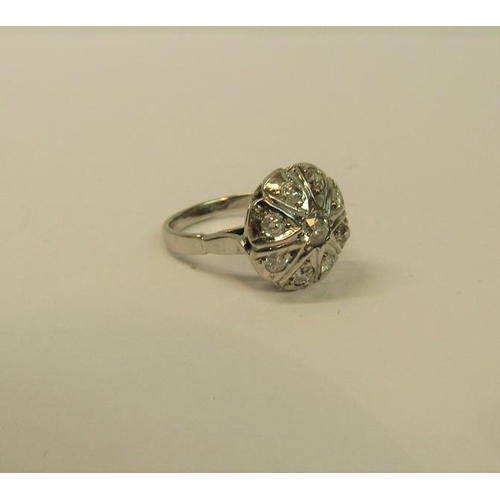 109 - A large and impressive white metal ring set with old cut diamonds - ring size N