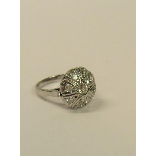 109 - A large and impressive white metal ring set with old cut diamonds - ring size N