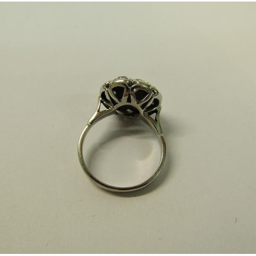 109 - A large and impressive white metal ring set with old cut diamonds - ring size N