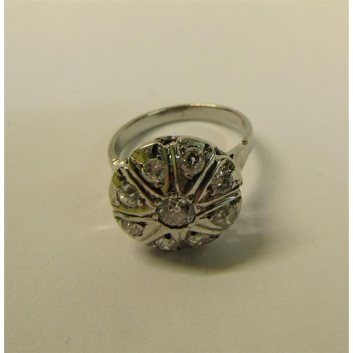 109 - A large and impressive white metal ring set with old cut diamonds - ring size N