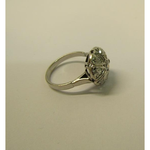 109 - A large and impressive white metal ring set with old cut diamonds - ring size N