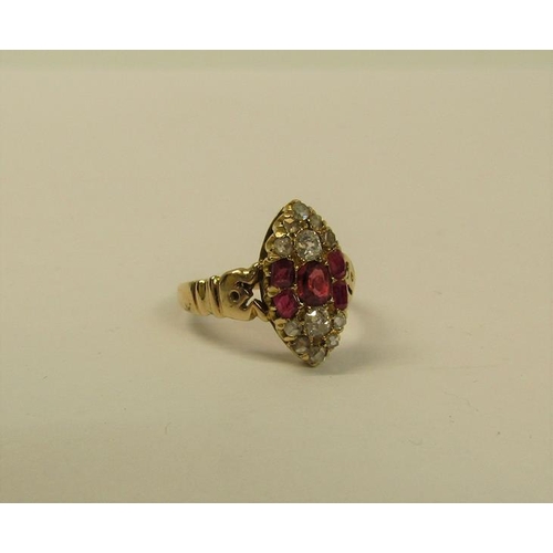 110 - A 15ct ring set with oval panel of rubies and old cut diamonds - ring size L 1/2