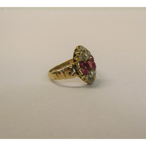 110 - A 15ct ring set with oval panel of rubies and old cut diamonds - ring size L 1/2