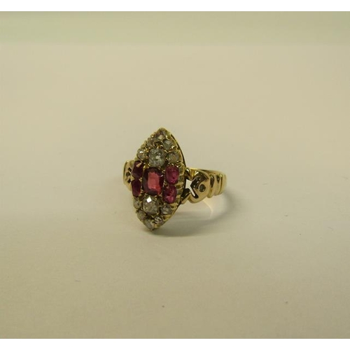 110 - A 15ct ring set with oval panel of rubies and old cut diamonds - ring size L 1/2