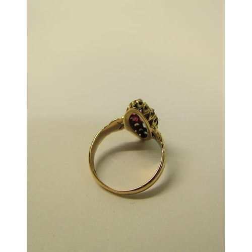 110 - A 15ct ring set with oval panel of rubies and old cut diamonds - ring size L 1/2