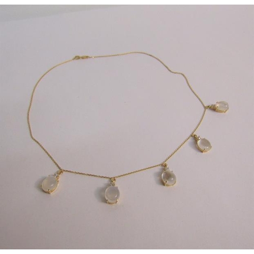 113 - An 18ct yellow gold necklet with Moonstone and diamond droplets