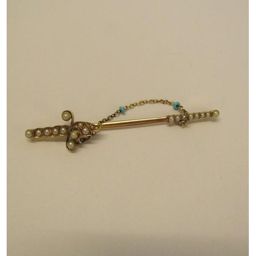 131 - A gold (not tested) pin brooch set with seed pearls and turquoise bead to the chain, 5.9g overall, 7... 