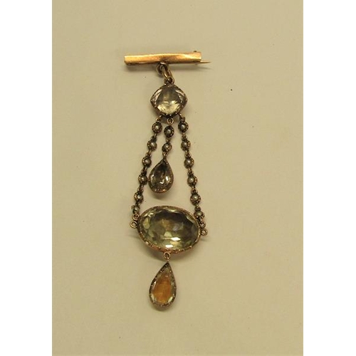 138 - An Edwardian unmarked gold pendant brooch set with Quartz and seed pearl