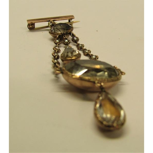 138 - An Edwardian unmarked gold pendant brooch set with Quartz and seed pearl