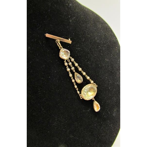 138 - An Edwardian unmarked gold pendant brooch set with Quartz and seed pearl