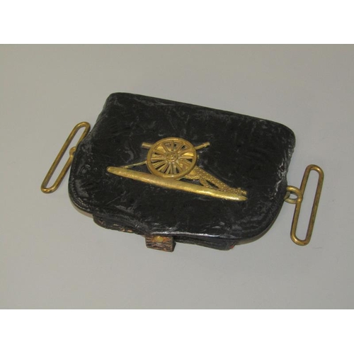 3 - A 19c Artillery officers black leather pouch, the flap with a brass field gun and having leaf moulde... 