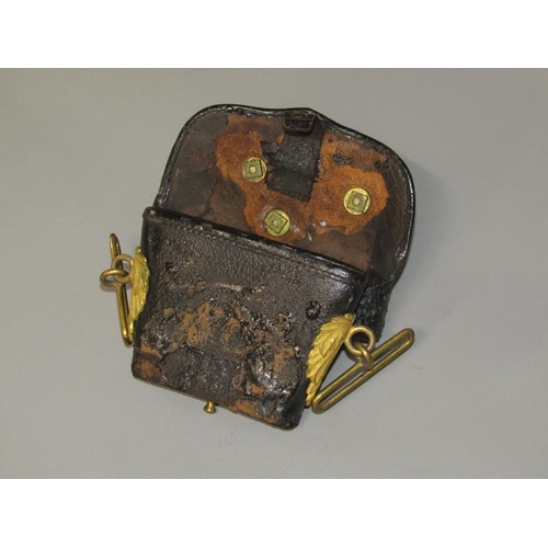 3 - A 19c Artillery officers black leather pouch, the flap with a brass field gun and having leaf moulde... 