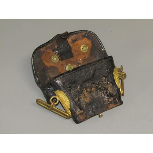 3 - A 19c Artillery officers black leather pouch, the flap with a brass field gun and having leaf moulde... 